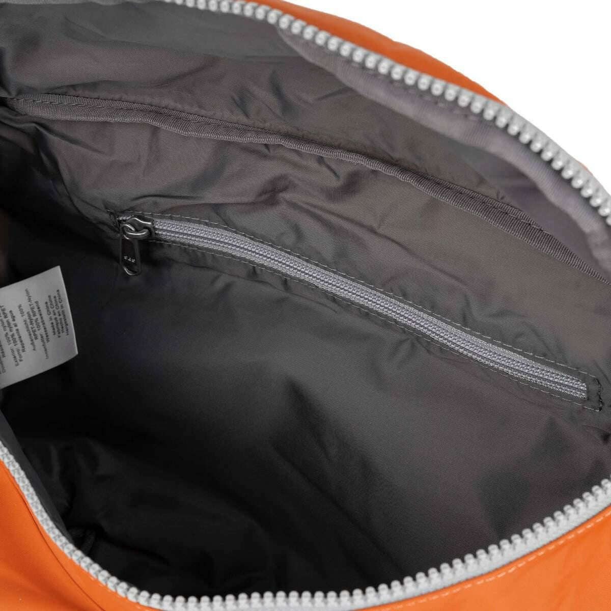 Roka Oval M XL Recycled Nylon Sling Bag - Burnt Orange - Image 4